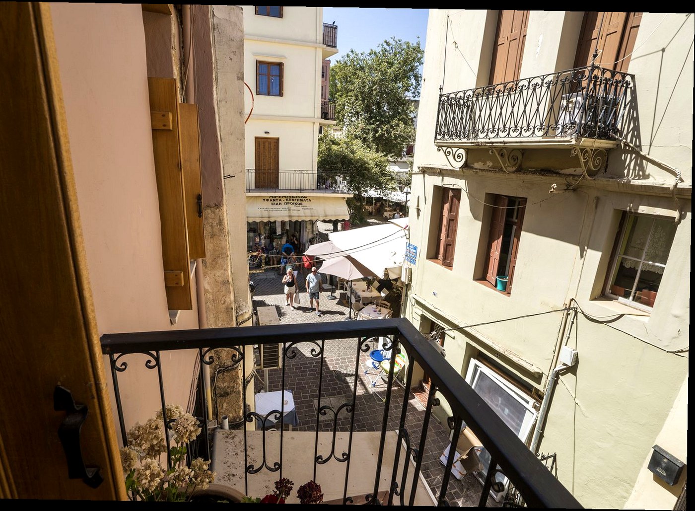 The view from the wrought-iron balcony of Horizon Terra House over a lane in Chania Old Town
